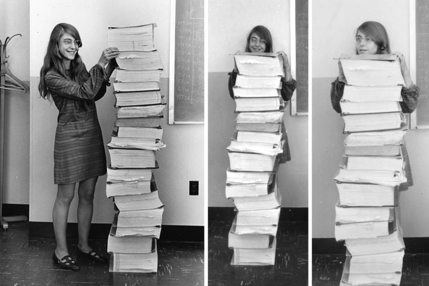 Margaret Hamilton standing by the Apollo Guidance Computer