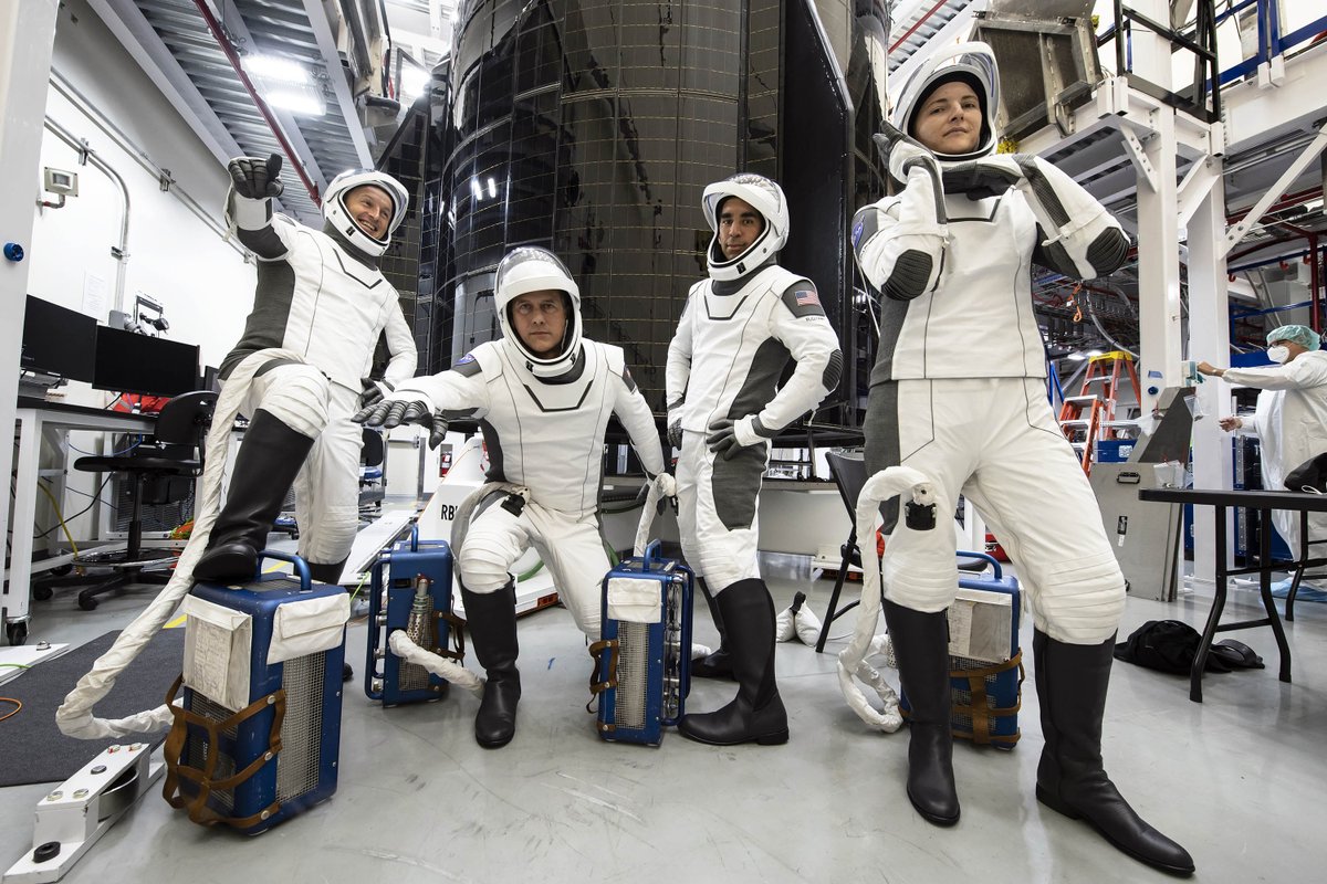 SpaceX Crew-3 in their suits and attached to Portable Ventilation Units (PVU).