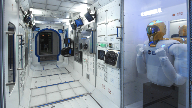 A model of Robonaut is displayed in a mock-up of the International Space Station