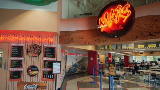 Neon signs welcome visitors to the restaurant