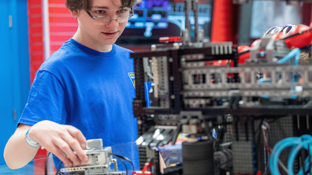 A camper prepares to test their robotic programing skills in a challenge