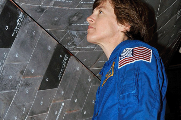 Lawrence inspects tiles that are part of the Space Shuttle's Thermal Control System. Credit: NASA