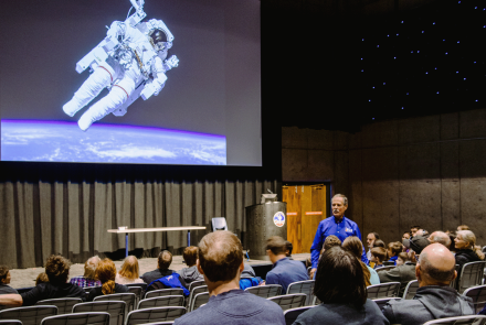 Astronaut Hoot Gibson speaks to a crowd at the U.S. Space & Rocket Center
